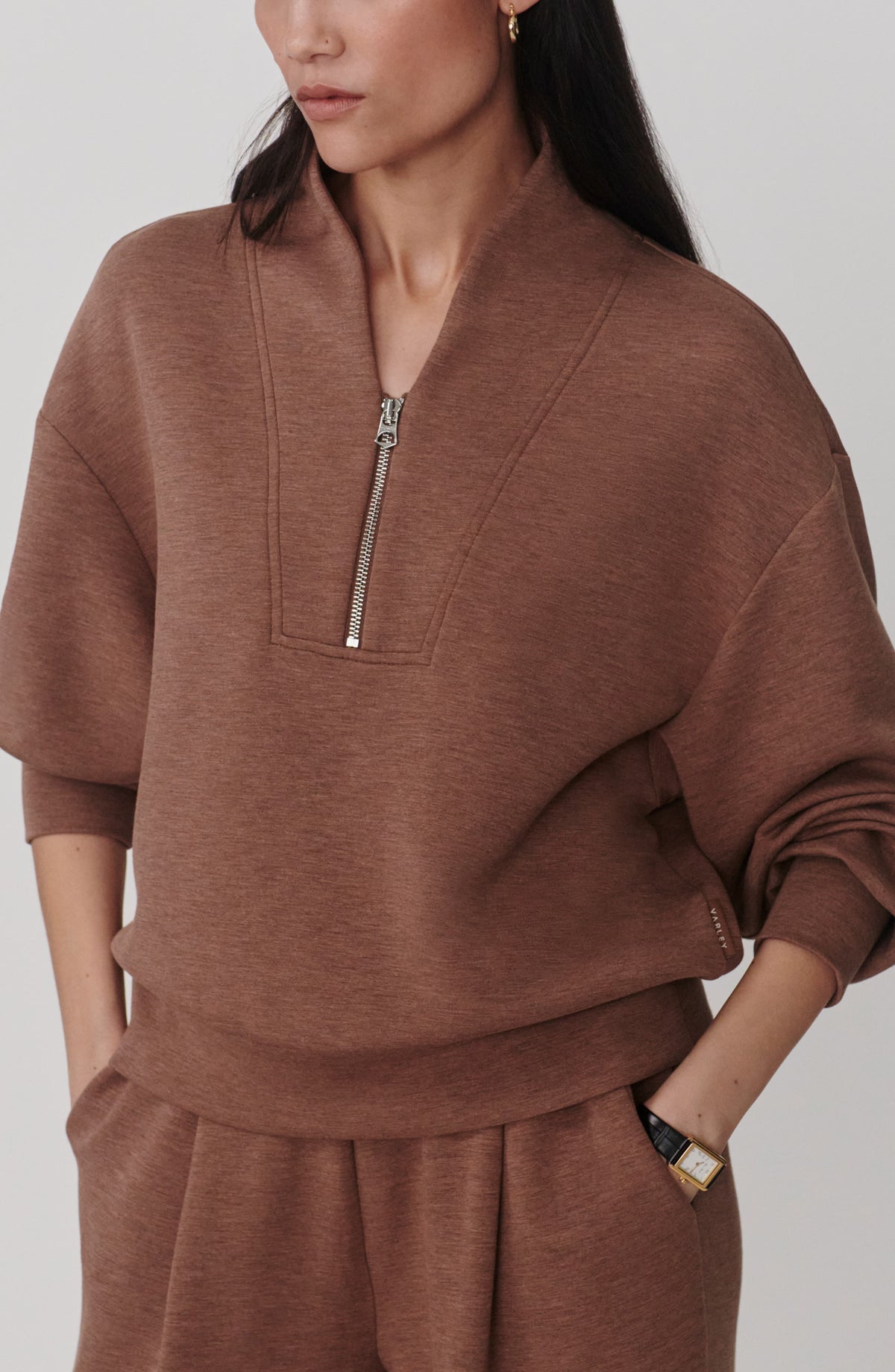 Bronze heather quarter-zip sweatshirt with stand collar, front view on model