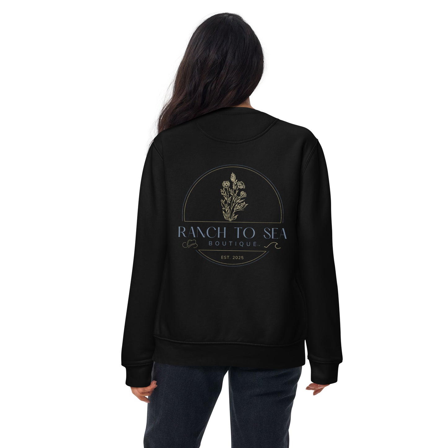 Person wearing a black sweatshirt with 'Ranch to Sea Boutique' logo on the back