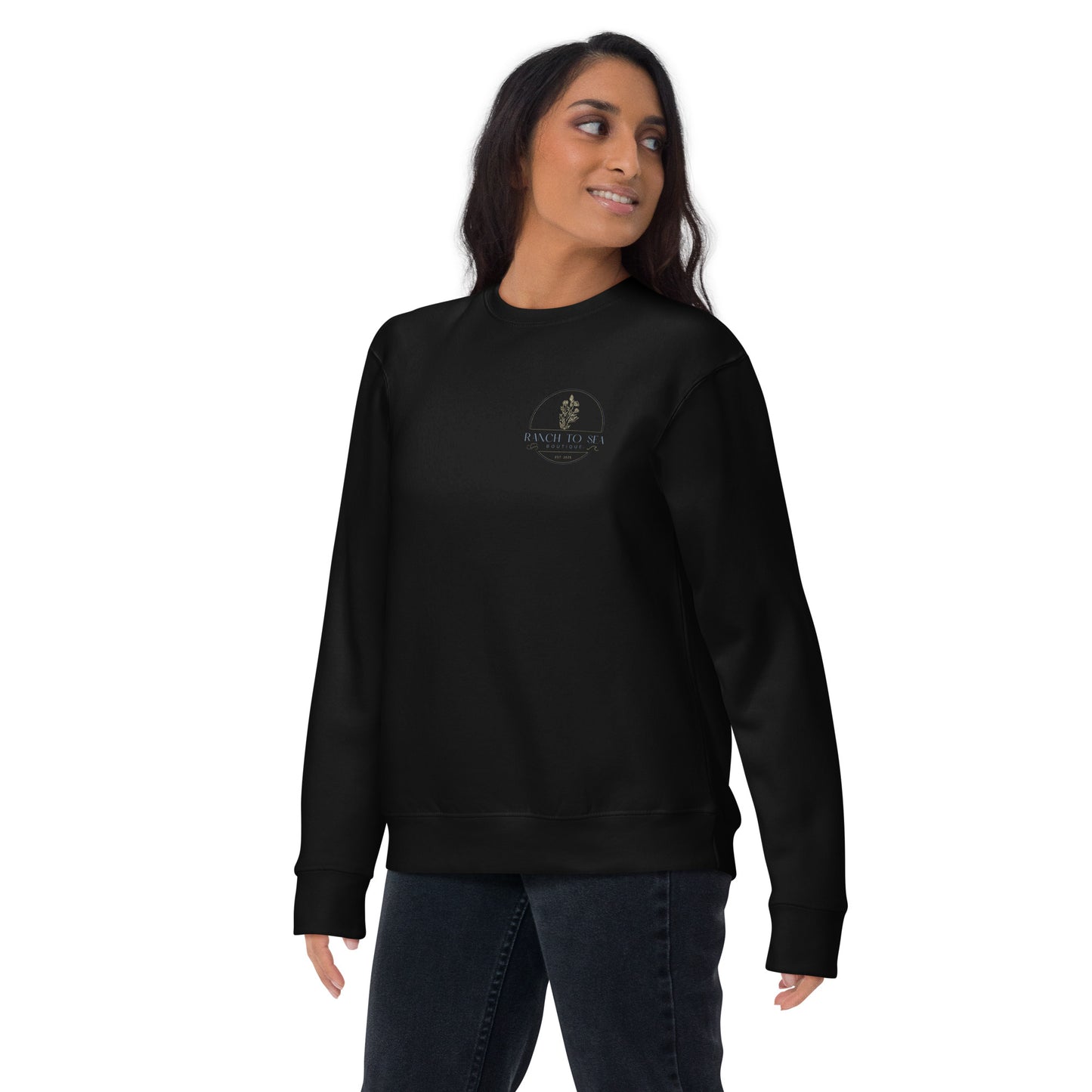 Person wearing a black sweatshirt with a logo on a white background