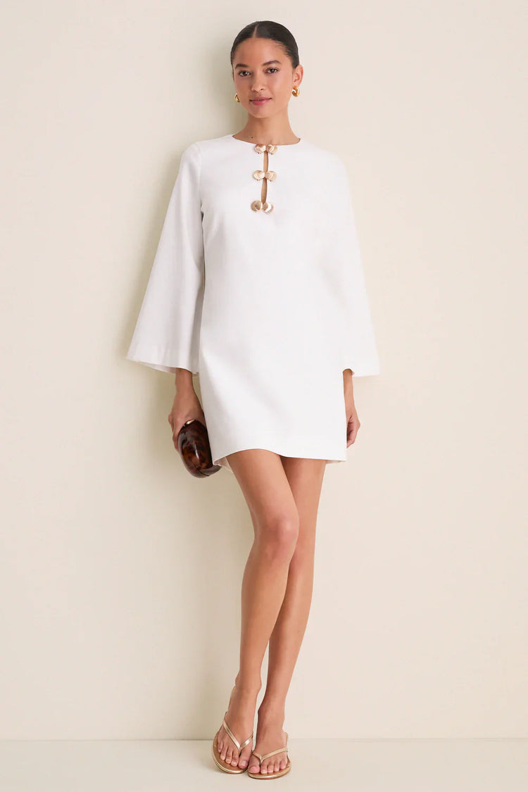 Ivory linen mini caftan — close-up of gold shell hardware detail and keyhole cut-out neckline-front view