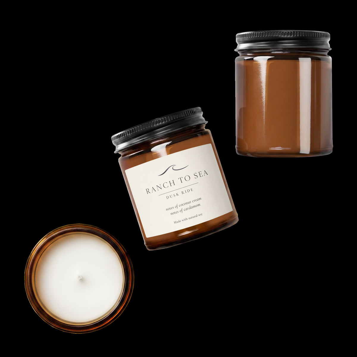 3 dusk ride natural soy candles in amber jars, two with lids one shown from top view.