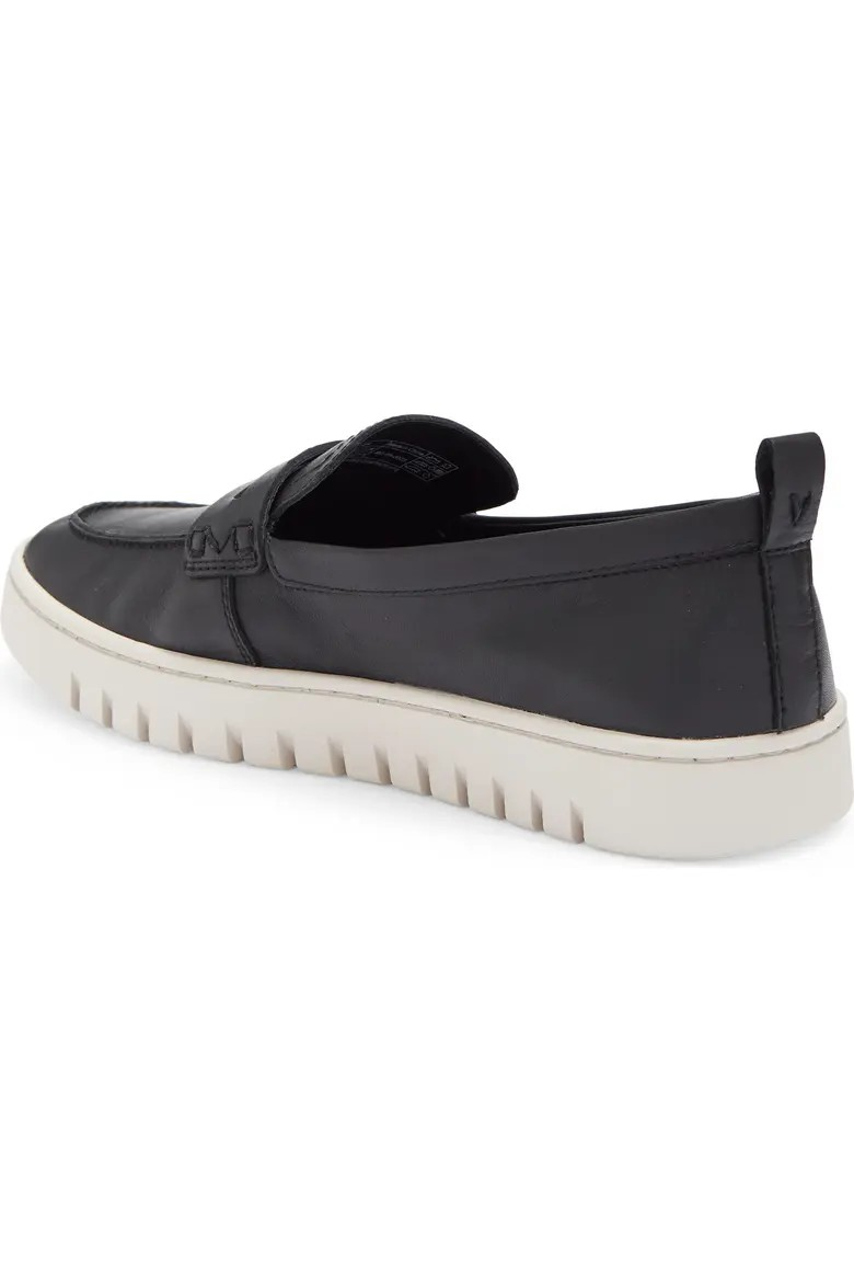 Black leather penny loafer three quarter view with heel pull tab 