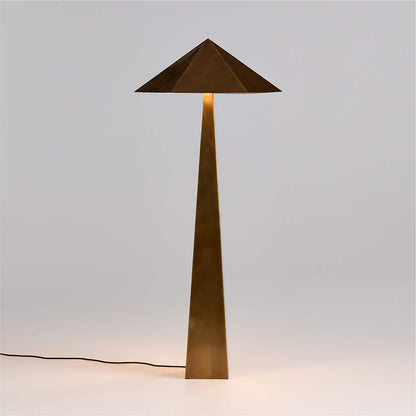 Modern brass geometric floor lamp with a geometric design on a light gray background