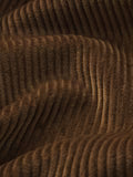 Cropped Hazelnut Corduroy Jacket – Front View close-up of a brown corduroy fabric texture, showing the vertical ribbed pattern and soft folds.