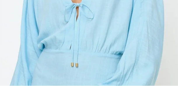 light blue mini coverup dress — close up of lightweight material and relaxed fit, detail shot
