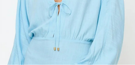light blue mini coverup dress — close up of lightweight material and relaxed fit, detail shot