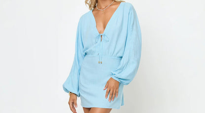 light blue mini coverup dress — soft fabric with mini length shown on model at beach, front view