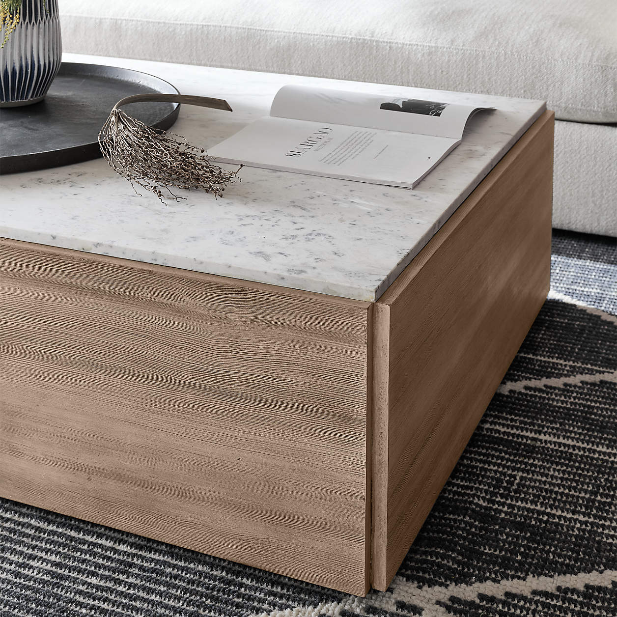 Marble Square Coffee Table with marble top on a patterned rug