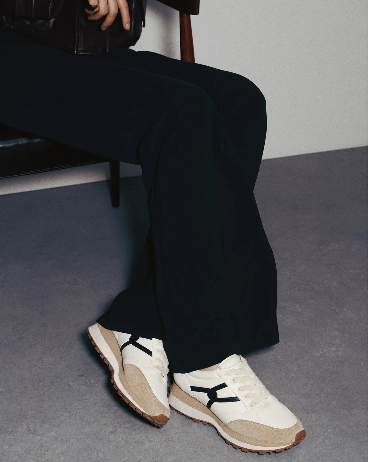 Pair of black white leather sneakers styled for everyday wear