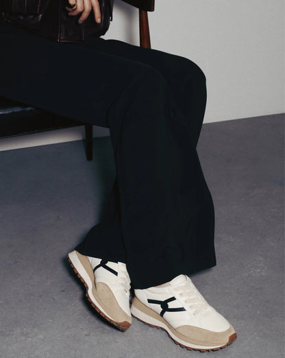 Pair of black white leather sneakers styled for everyday wear