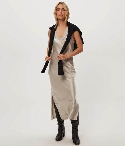 beige satin midi dress layered with a black jacket, on-model front view on white background