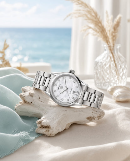 AI lifestyle: Silver mother of pearl watch with diamond hour markers resting on white driftwood against a soft coastal background.