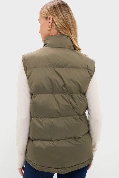 Back view-Person wearing an olive green puffer vest on a white background