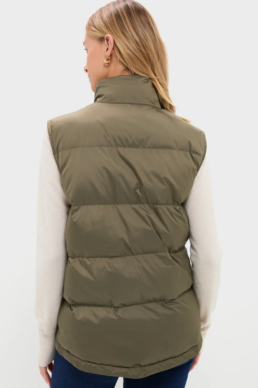 Back view-Person wearing an olive green puffer vest on a white background