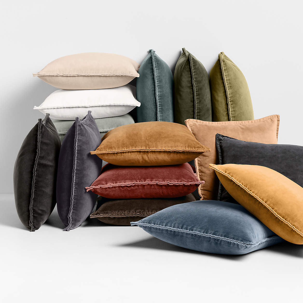 organic cotton velvet pillow covers  of colorful pillows on a light gray background