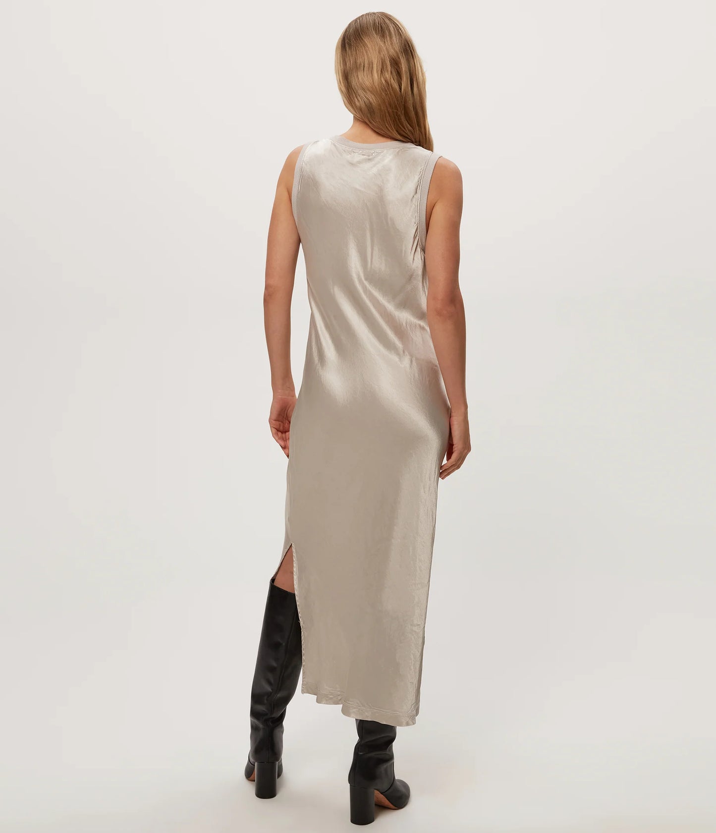 bias cut satin dress — beige sleeveless satin midi dress with side slit, on-model rear view-on white background