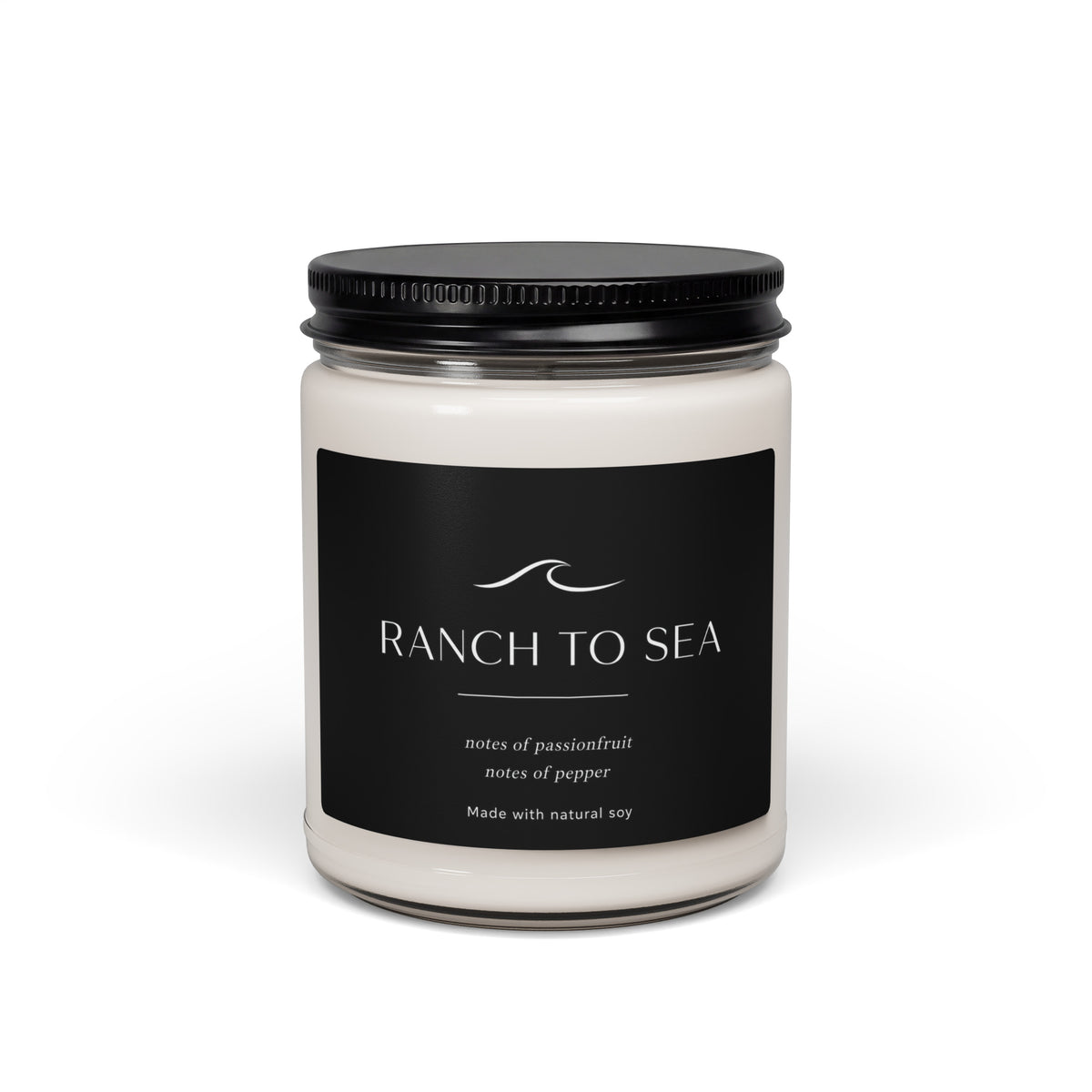 Candle jar with Ranch to Sea  black label on a white background
