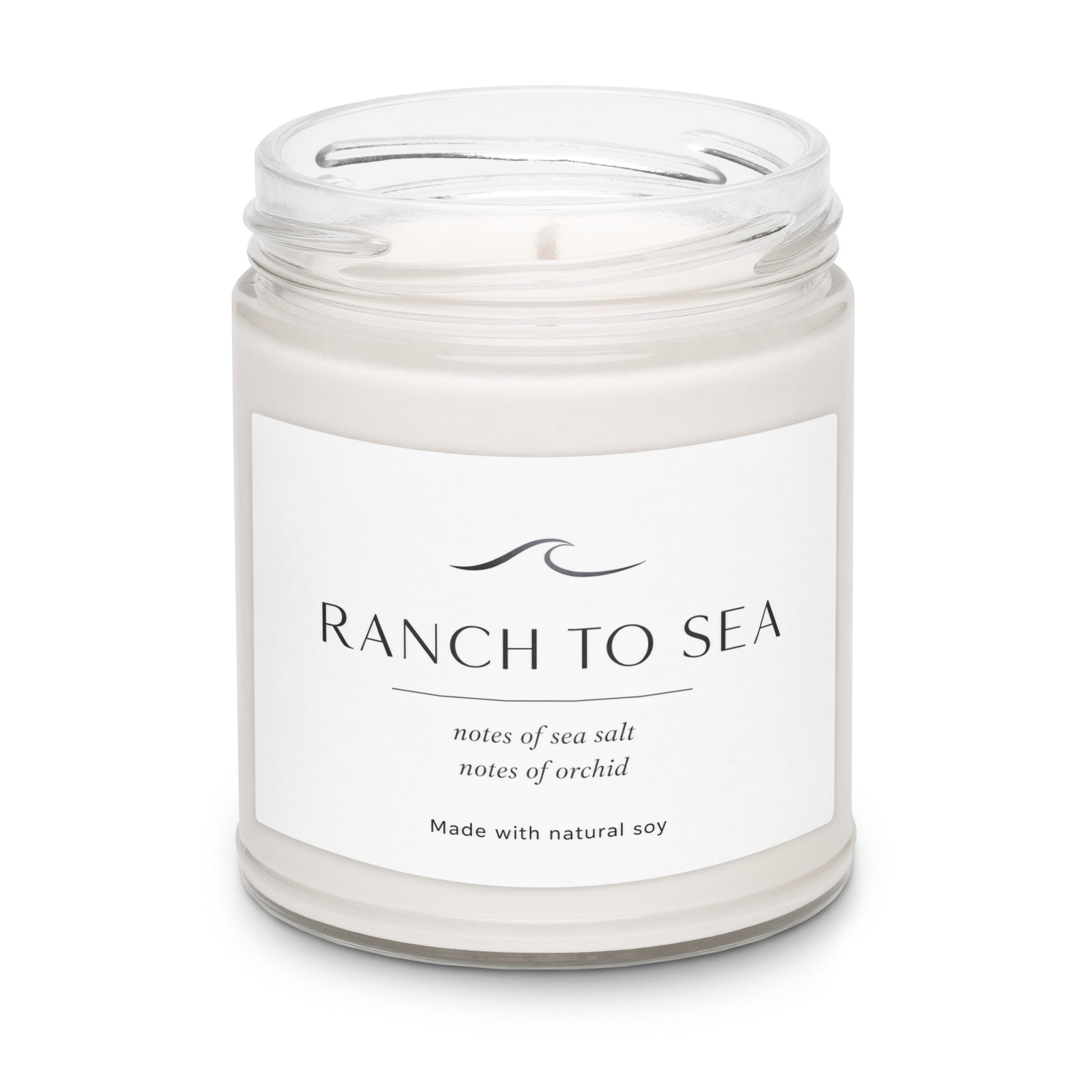 Product closeup after the fog natural soy candle in glass jar 
